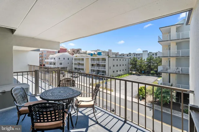 a view of a balcony with furniture