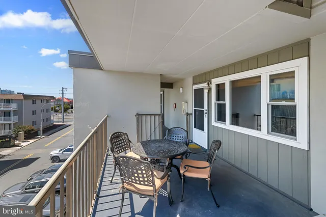 a outdoor living space with furniture and a flat screen tv