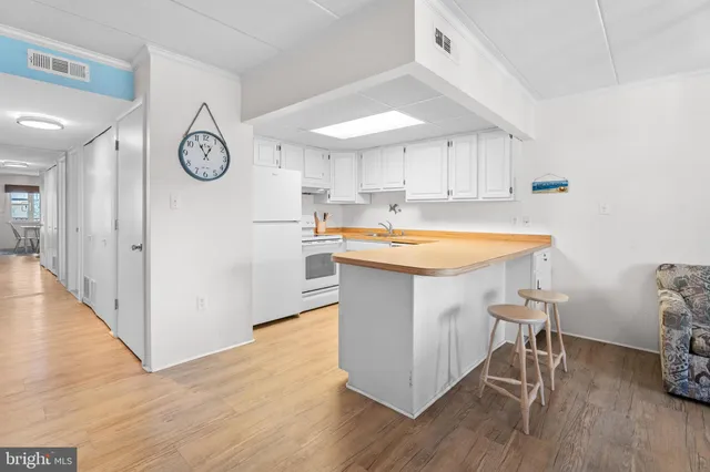 a kitchen with a table and chairs