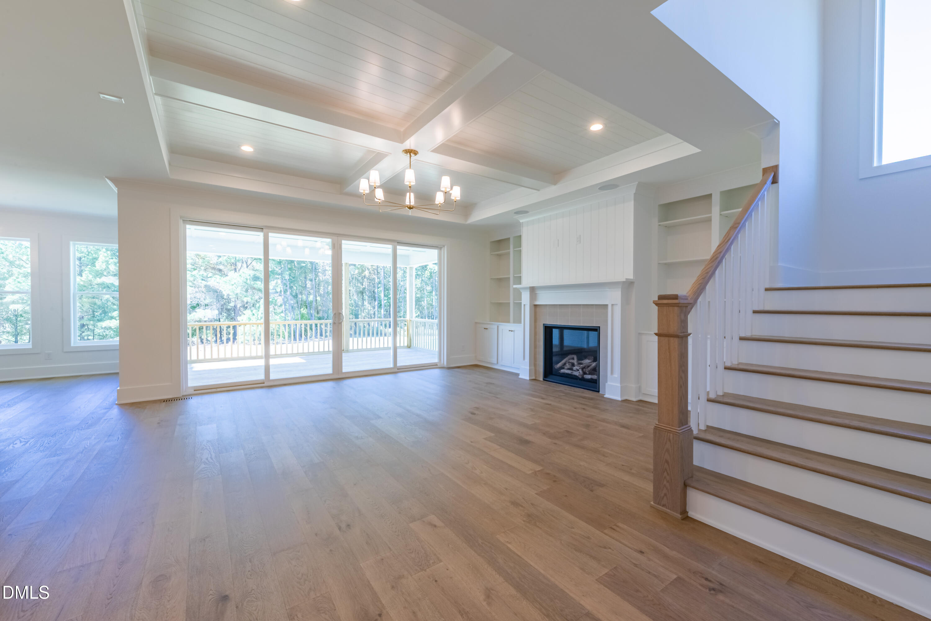 5709 Flowery Mdw Court Wake Forest, NC 27587 - Photo 16 of 69 a view of an empty room with wooden floor fireplace and a window