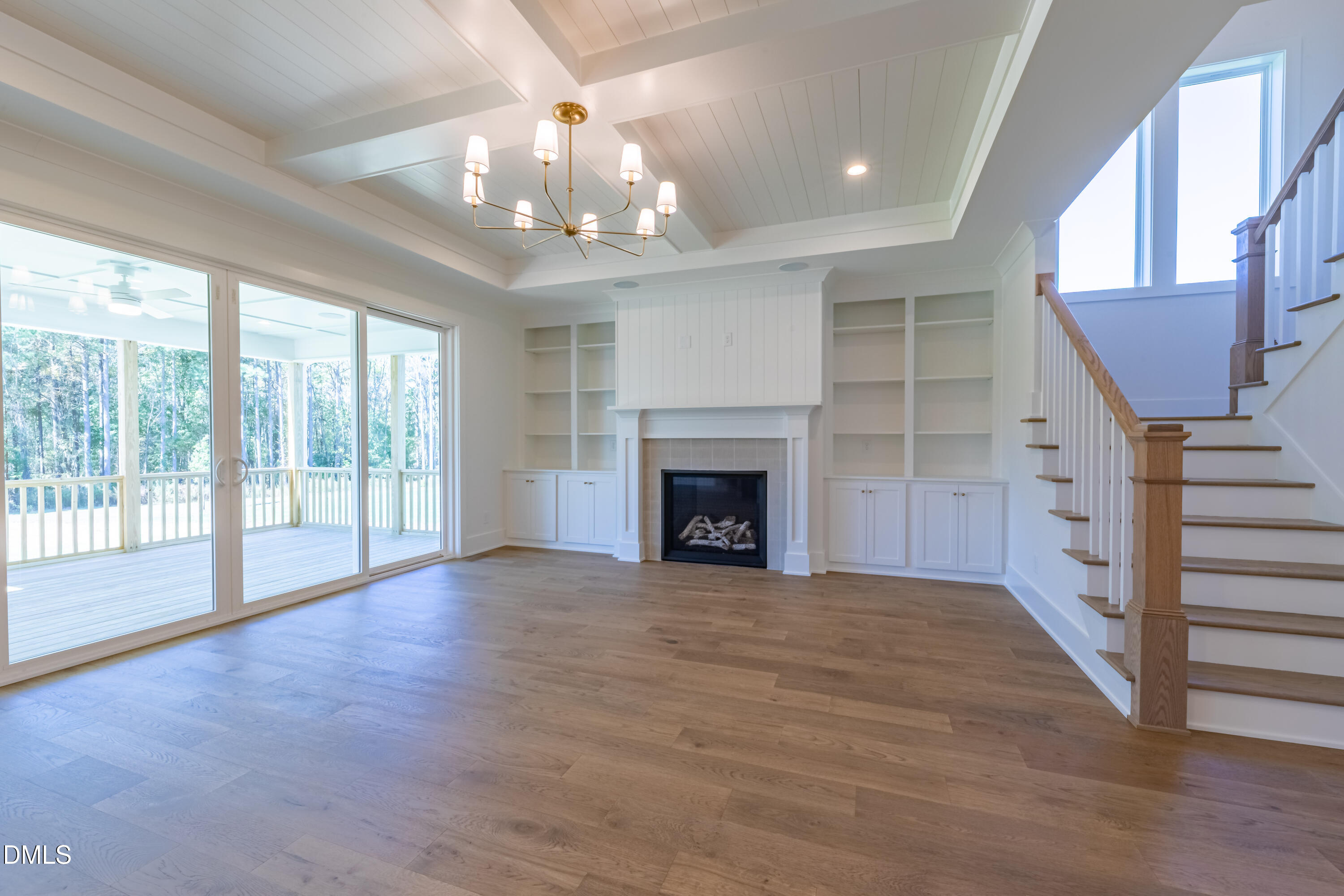 5709 Flowery Mdw Court Wake Forest, NC 27587 - Photo 17 of 69 a view of an empty room with a fireplace and a window