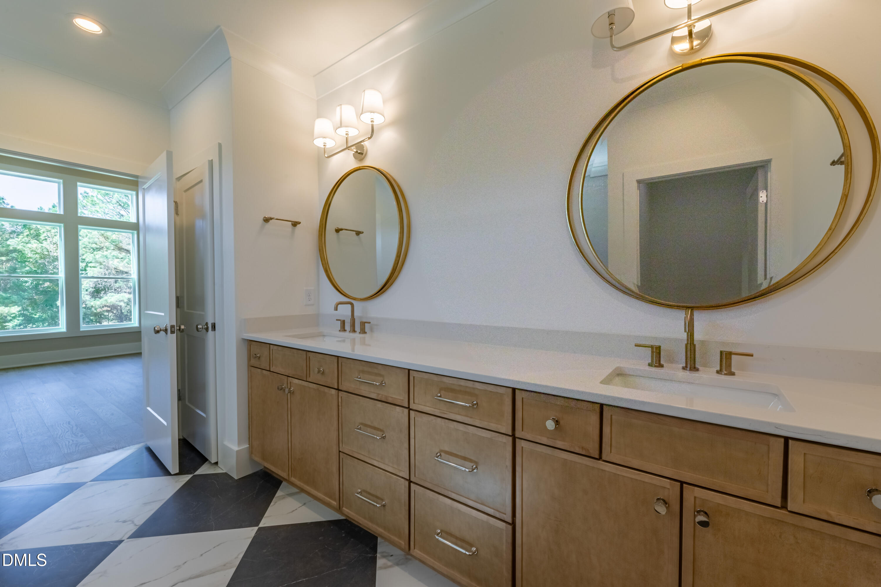 5709 Flowery Mdw Court Wake Forest, NC 27587 - Photo 42 of 69 a bathroom with a double vanity sink and a mirror