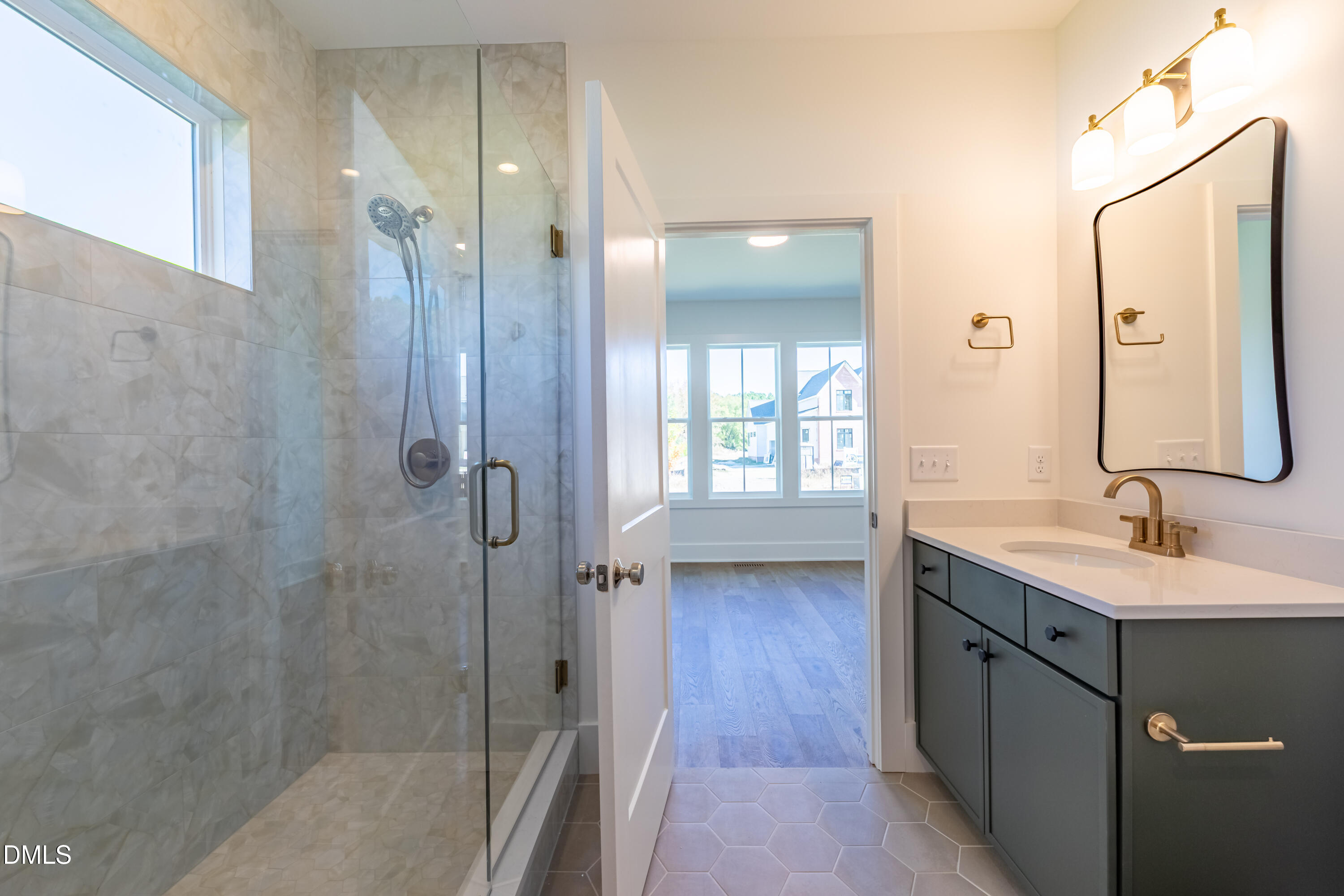 5709 Flowery Mdw Court Wake Forest, NC 27587 - Photo 48 of 69 a bathroom with a double vanity sink mirror and shower