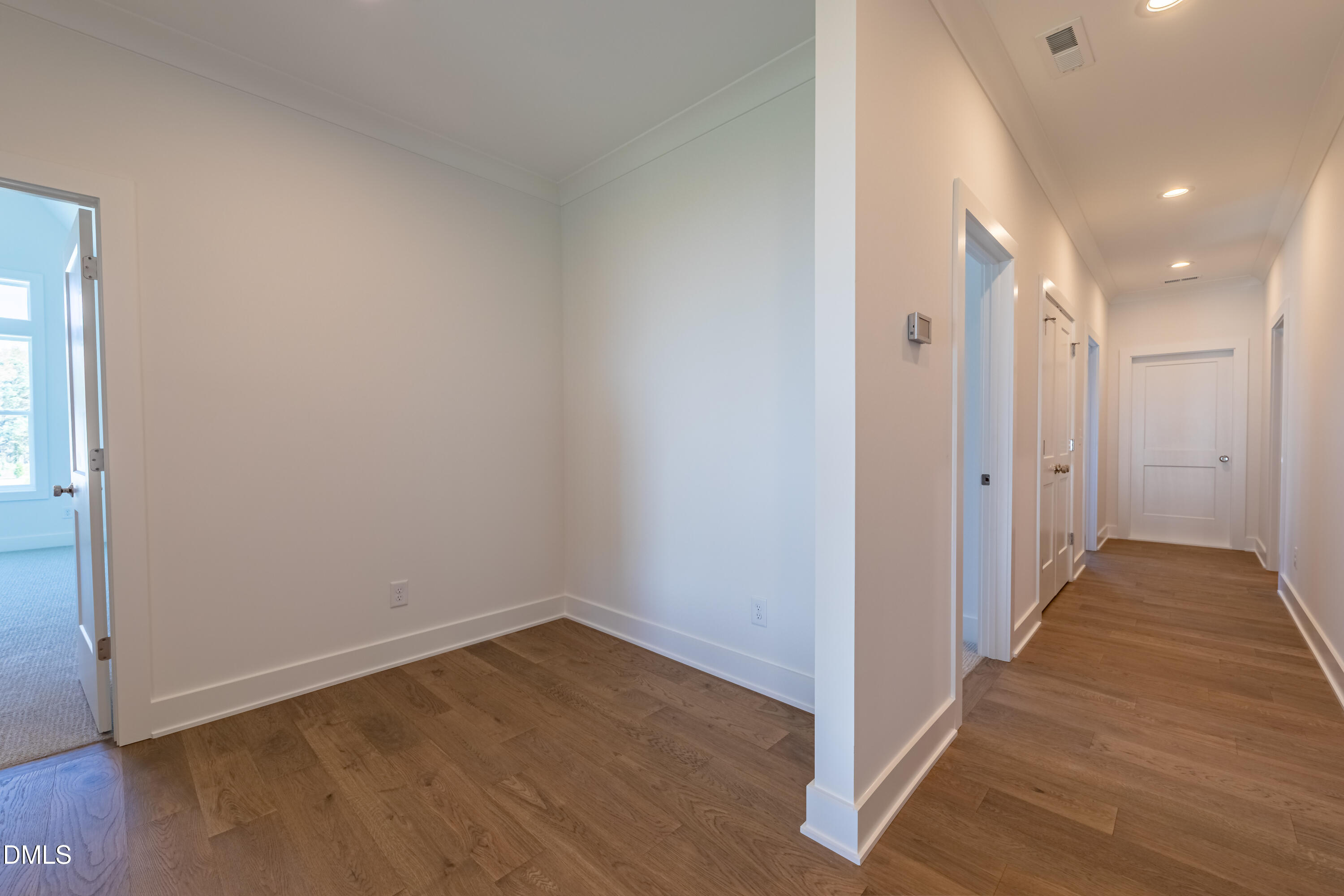 5709 Flowery Mdw Court Wake Forest, NC 27587 - Photo 51 of 69 a view of a hallway with wooden floor