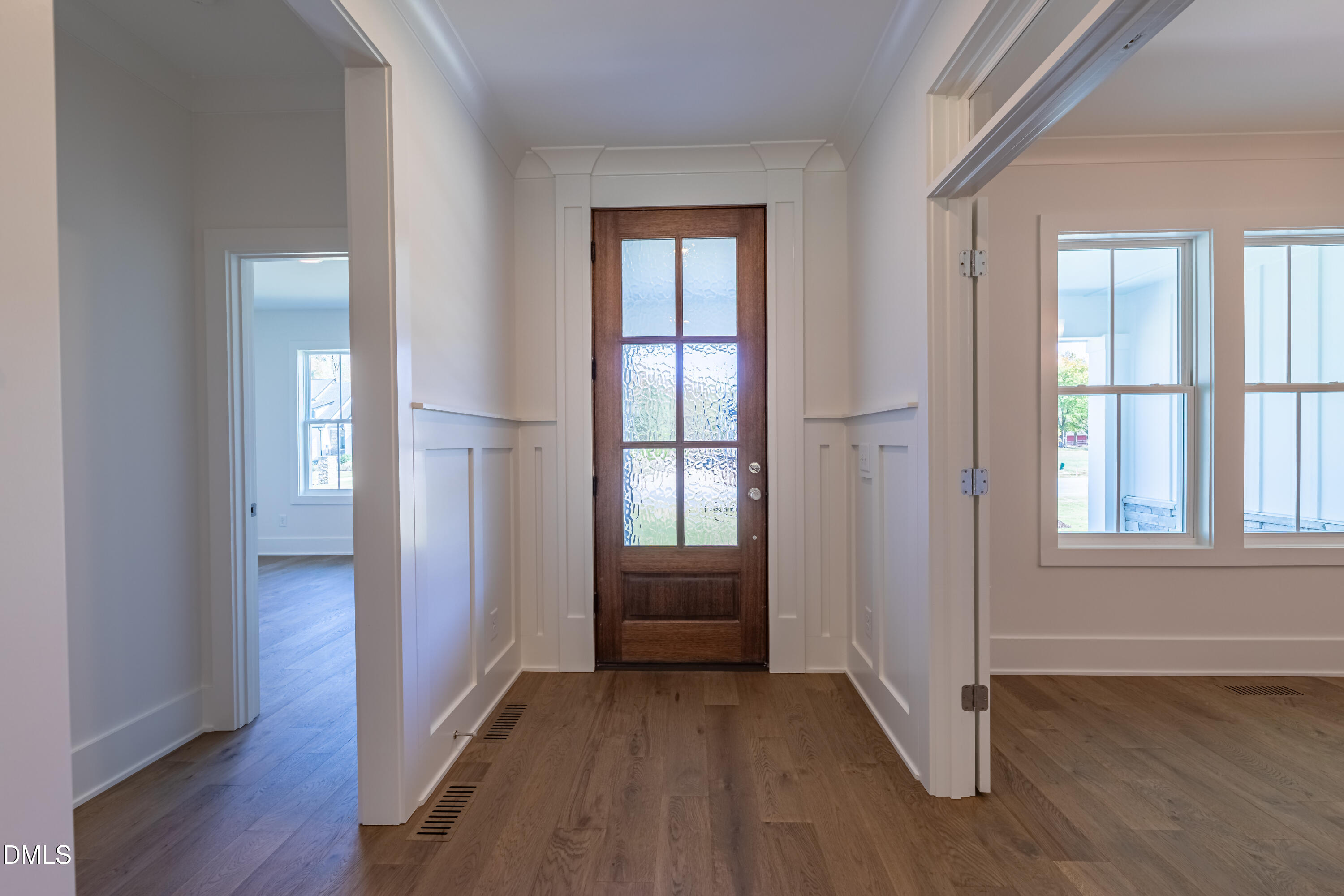 5709 Flowery Mdw Court Wake Forest, NC 27587 - Photo 8 of 69 an empty room with wooden floor and windows