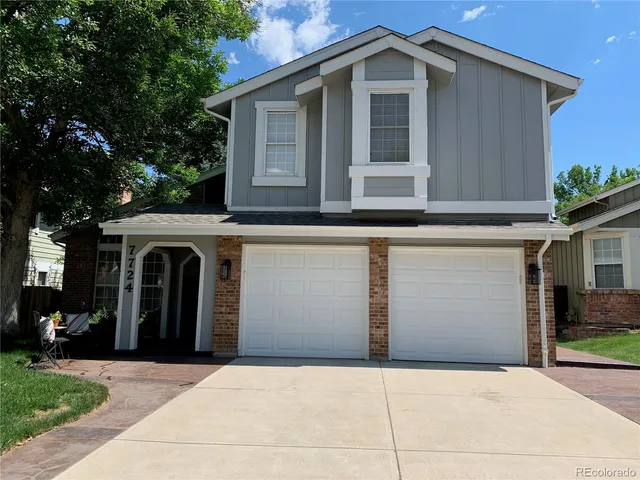 a front view of a house with yard