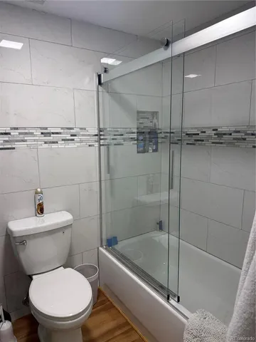a bathroom with a toilet a sink and bathtub