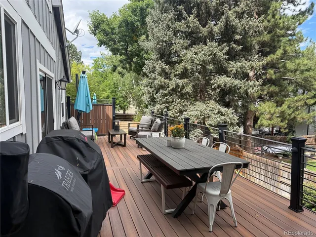 a view of a dinning tables and chairs in deck
