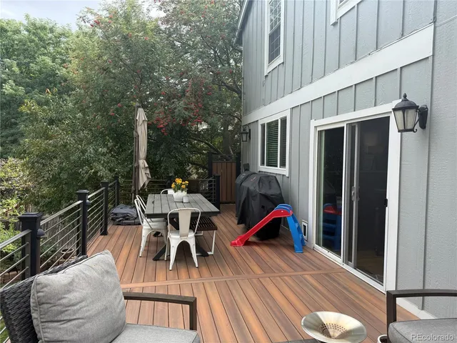 a view of a patio with a table and chairs