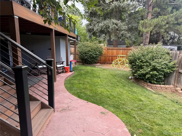 a view of a backyard with potted plants