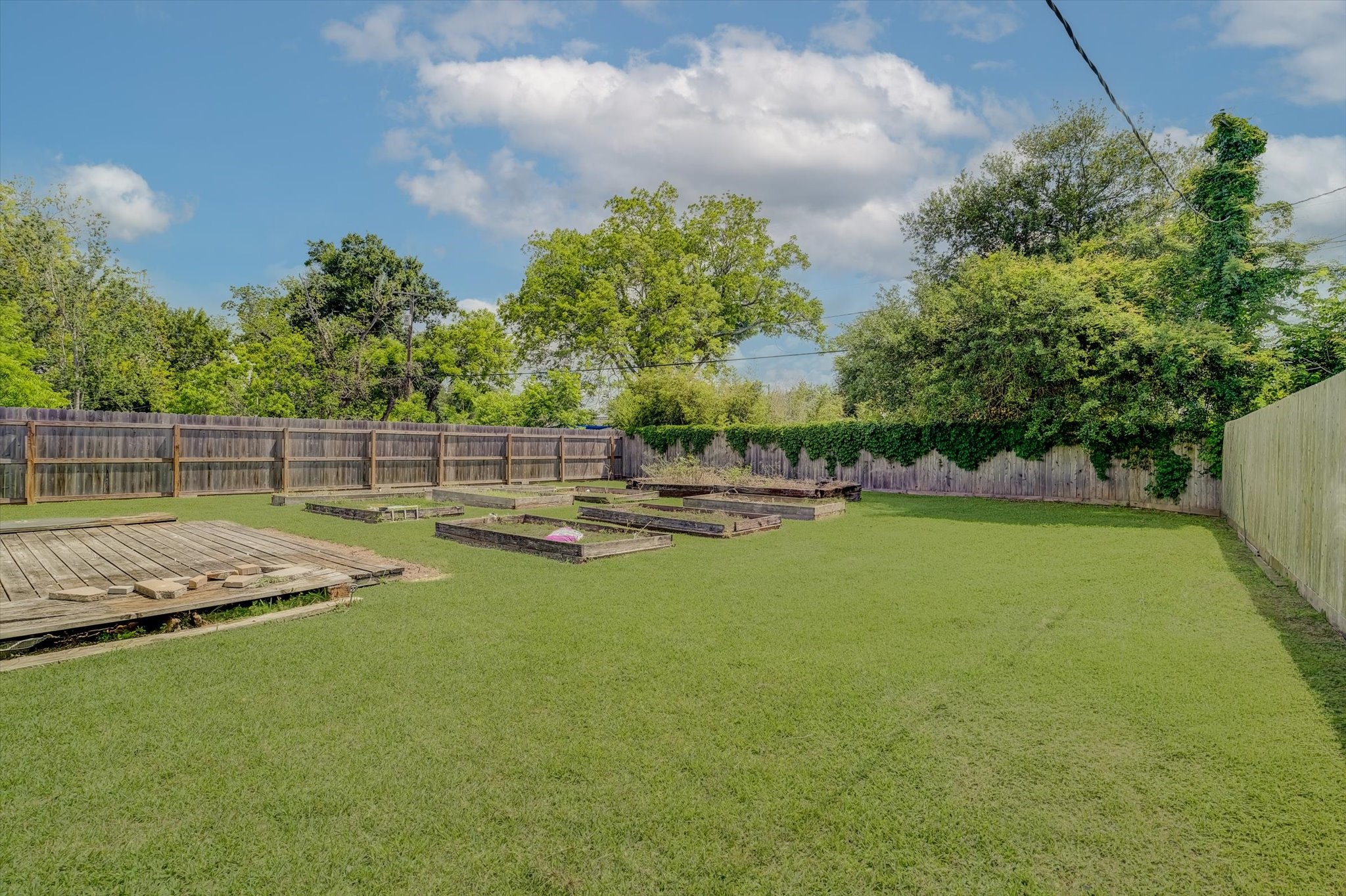 413 Farrer Street Angleton, TX 77515 - Photo 41 of 43 a view of a garden with lawn chairs