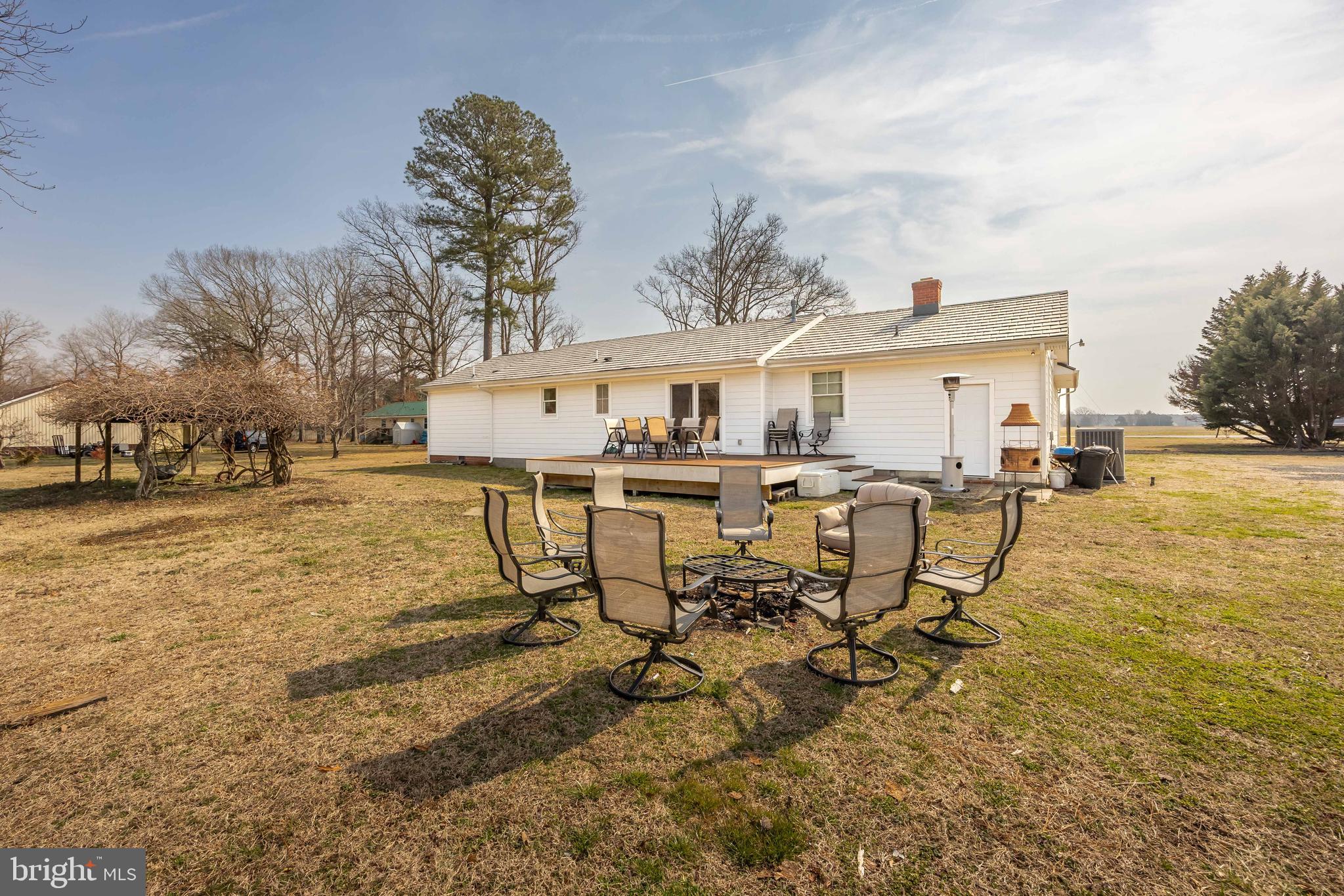 14470 Backbone Road Eden, MD 21822 - Photo 48 of 55 a view of a patio with table and chairs with wooden fence