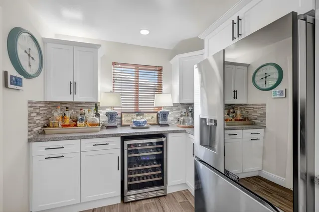a kitchen with stainless steel appliances a stove and a refrigerator