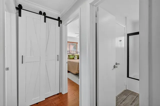 a view of a bathroom from a hallway