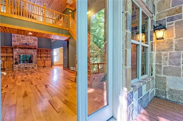 a bathroom with a shower and a glass door