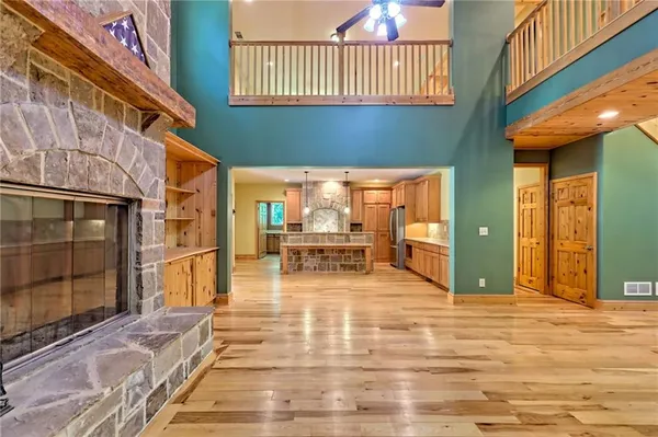 a view of a room with wooden floor and natural light