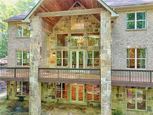 a kitchen with stainless steel appliances granite countertop a refrigerator a sink and a stove