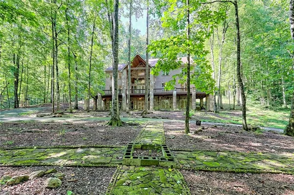 a kitchen with stainless steel appliances granite countertop a sink a refrigerator and a stove