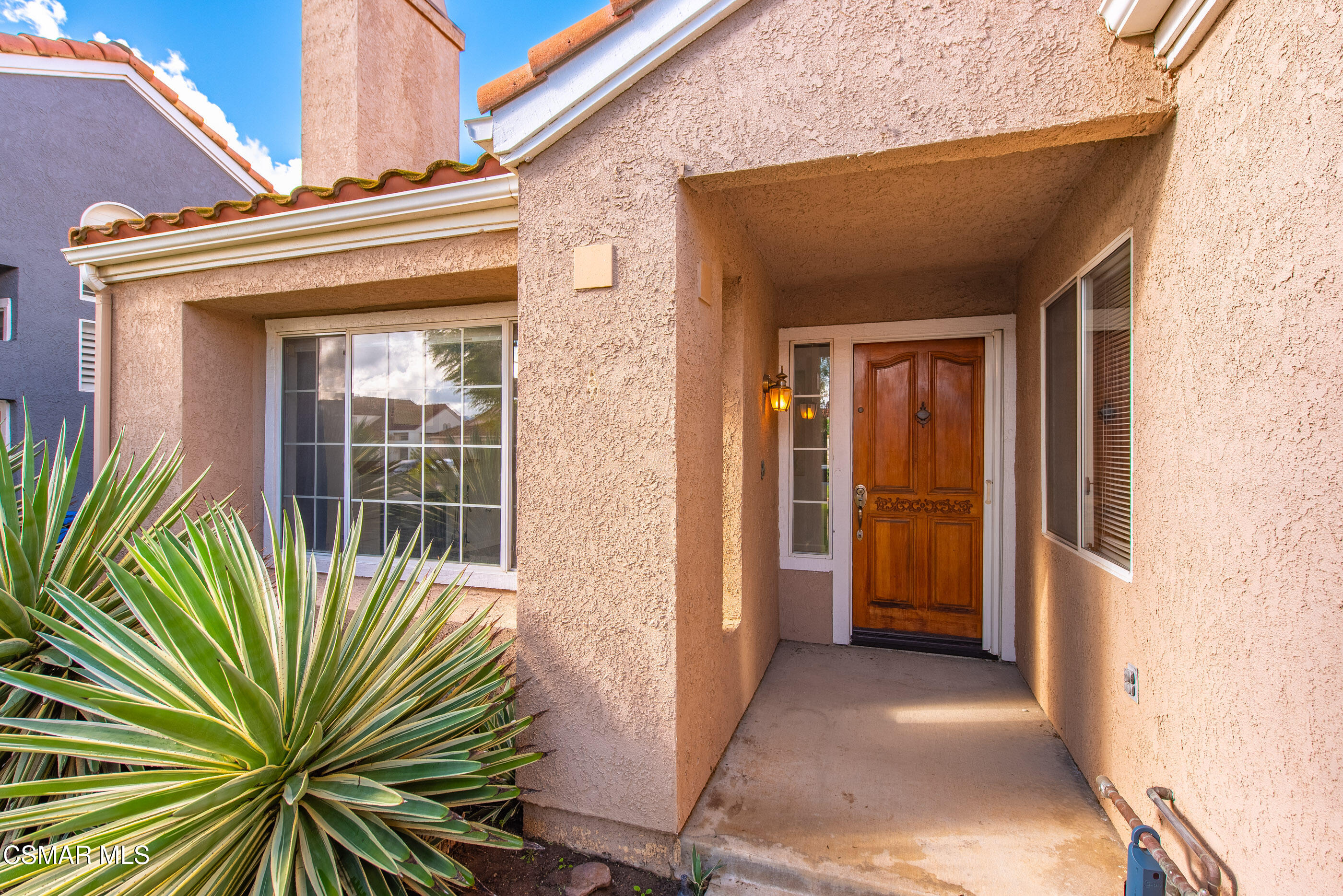 2565 Winthrop Court Simi Valley, CA 93065 - Photo 2 of 37 a view of a house with a potted plant and a window