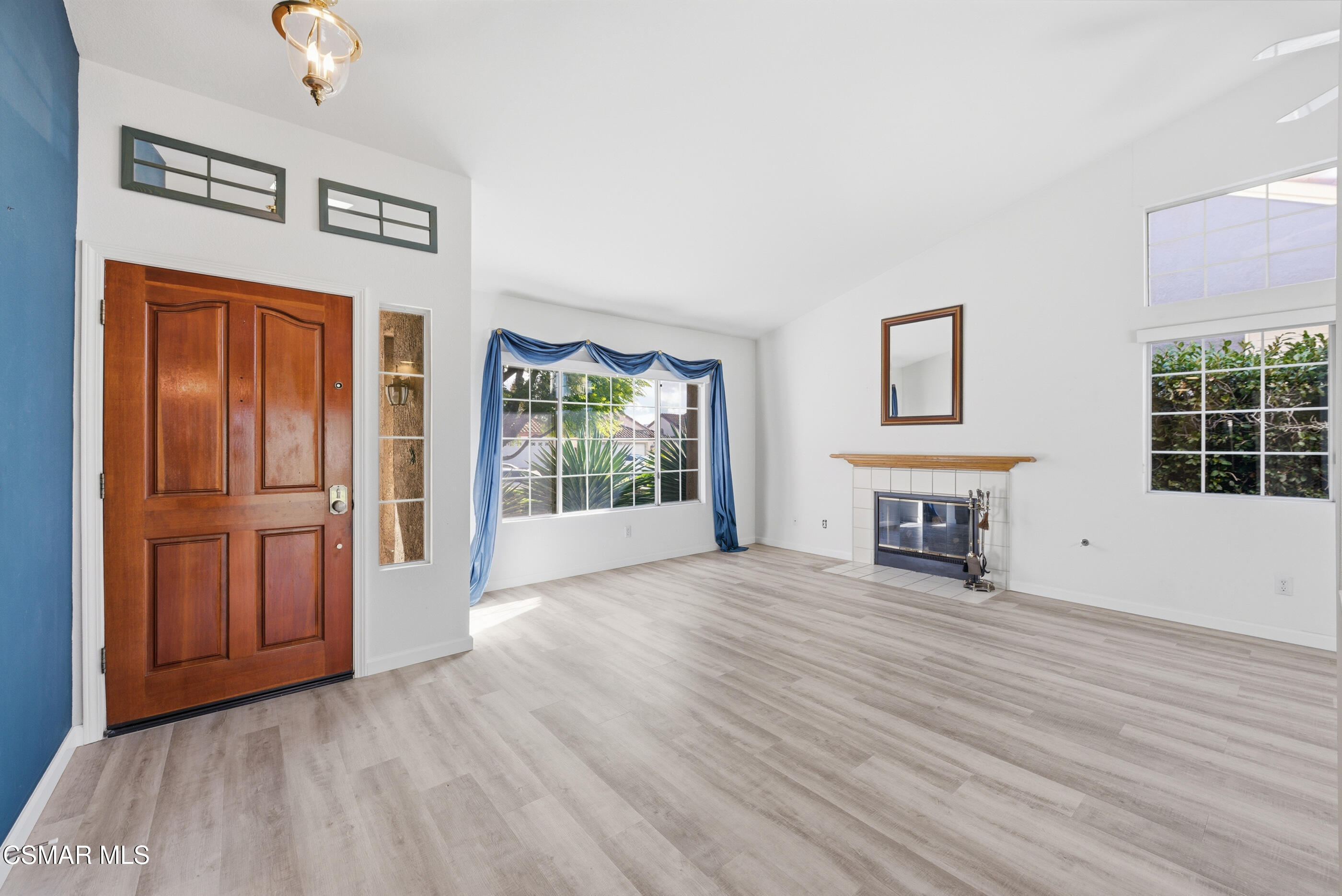 2565 Winthrop Court Simi Valley, CA 93065 - Photo 4 of 37 a view of an empty room with glass door and wooden floor