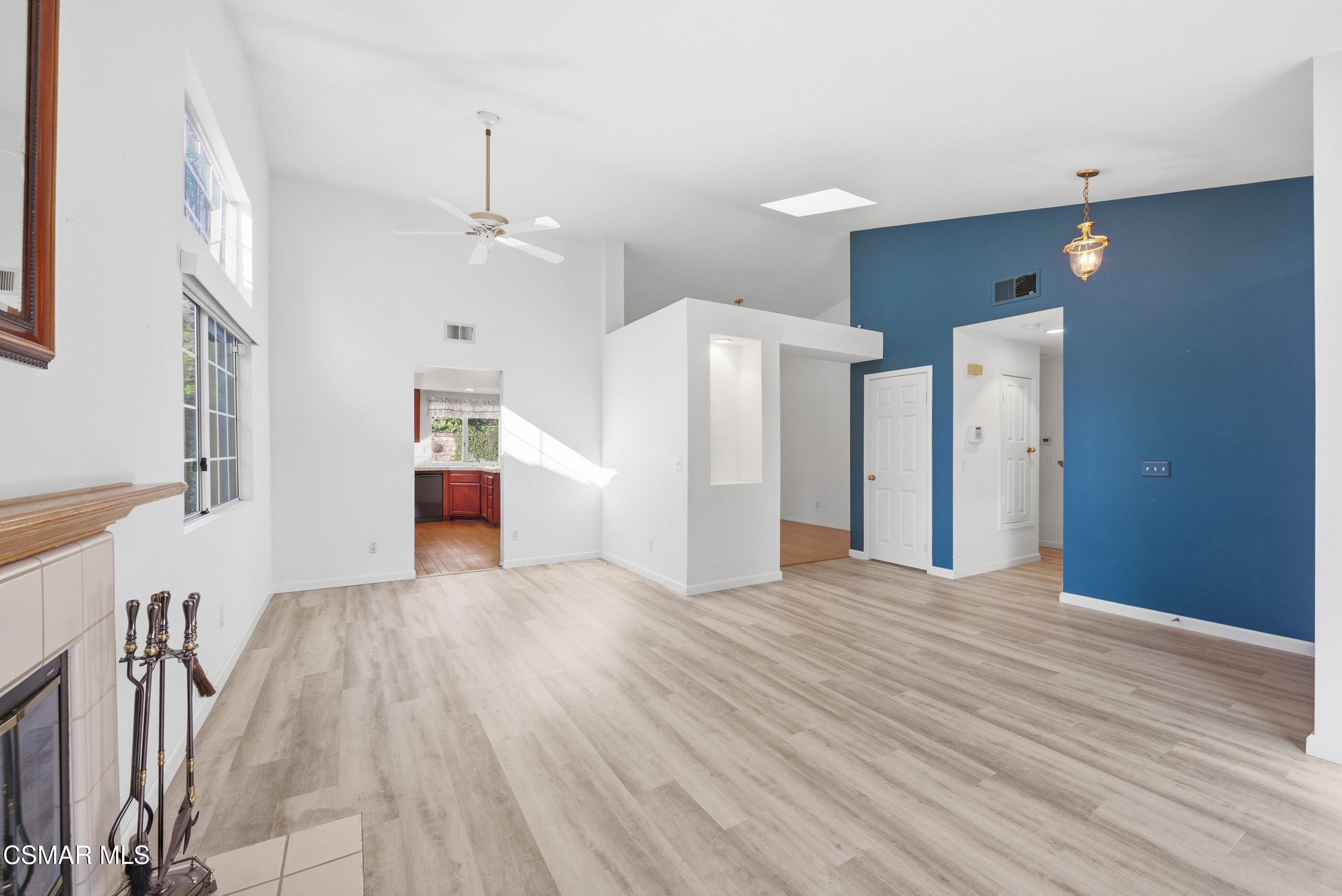 2565 Winthrop Court Simi Valley, CA 93065 - Photo 6 of 37 a view of empty room with wooden floor and fireplace