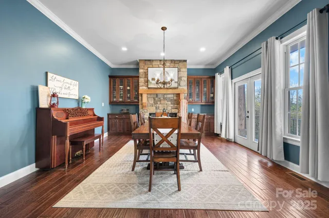 a living room with furniture a piano and a fireplace