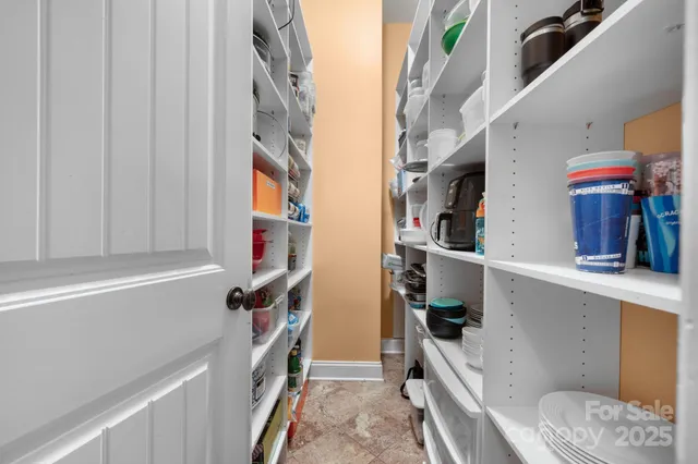 a kitchen with stainless steel appliances granite countertop a refrigerator and a stove