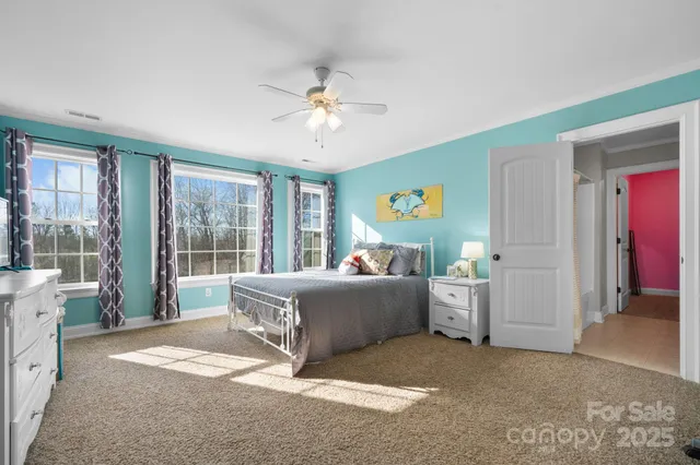 a living room with furniture and windows