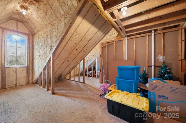 a view of an entryway with wooden floor and door