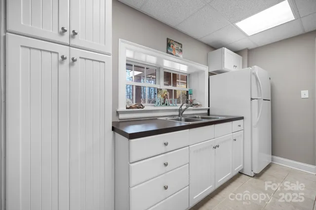 a view of a dinning table and chairs in patio of the house