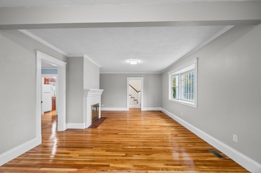25 Tedesco Street Marblehead, MA 01945 - Photo 13 of 42 a view of empty room with wooden floor and fan