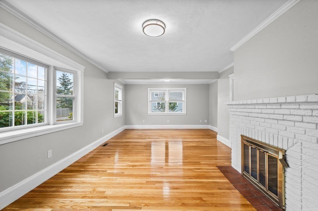 25 Tedesco Street Marblehead, MA 01945 - Photo 18 of 42 a view of an empty room with wooden floor and a window