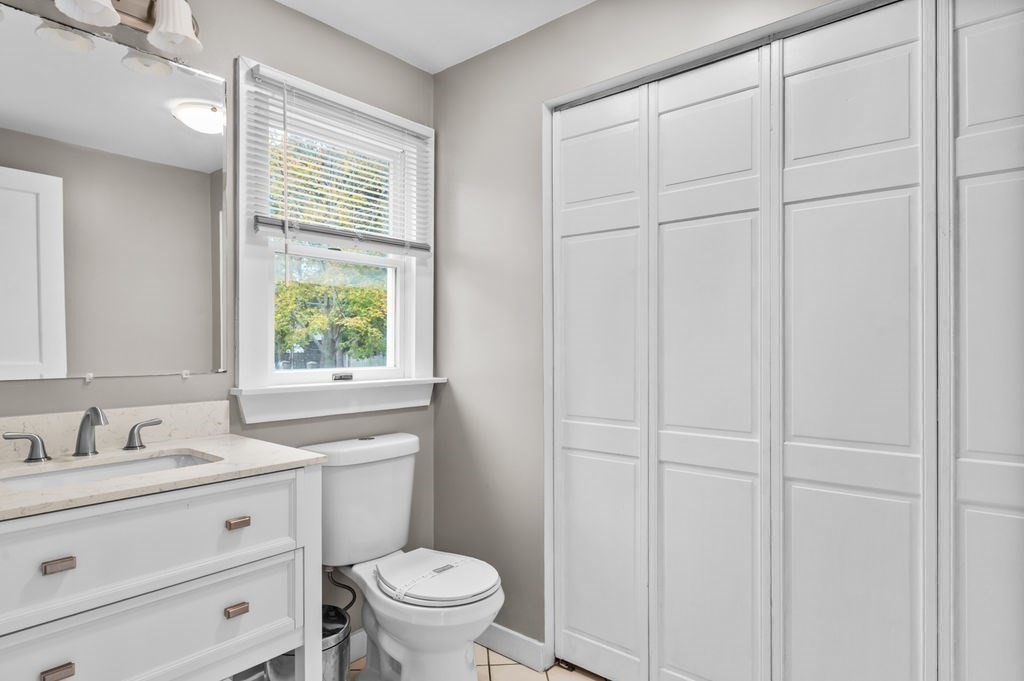 25 Tedesco Street Marblehead, MA 01945 - Photo 23 of 42 a bathroom with a sink a toilet and a window