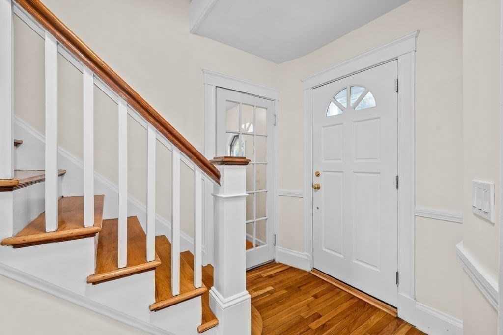 25 Tedesco Street Marblehead, MA 01945 - Photo 24 of 42 a view of an entryway with wooden floor and door
