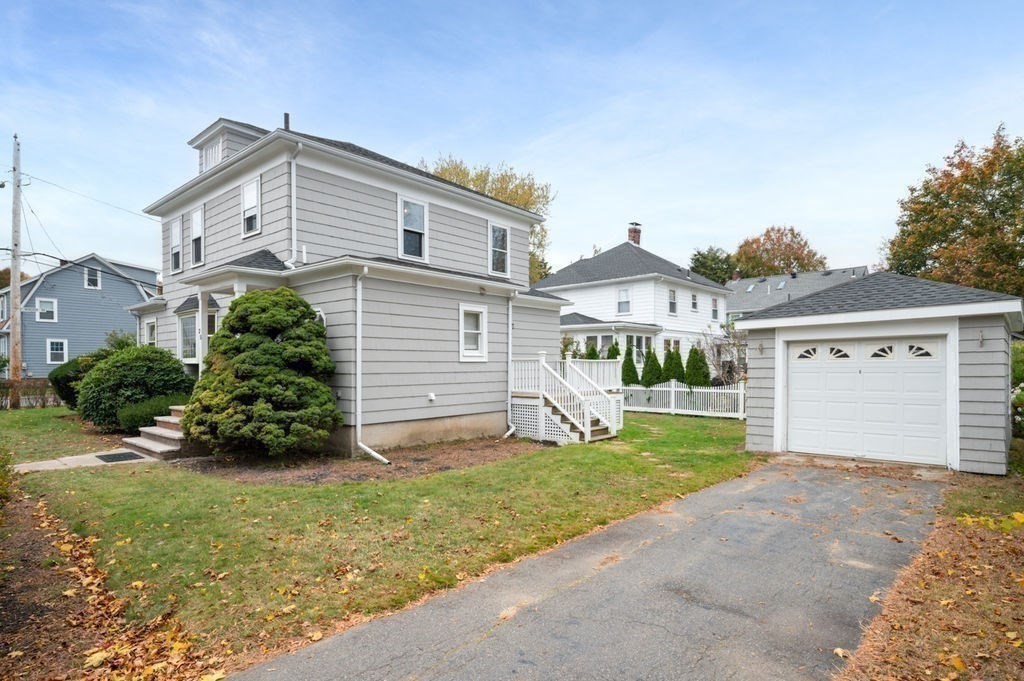 25 Tedesco Street Marblehead, MA 01945 - Photo 3 of 42 a front view of house with yard and green space