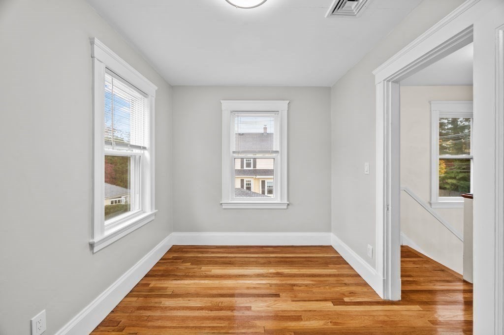 25 Tedesco Street Marblehead, MA 01945 - Photo 32 of 42 a view of an empty room with wooden floor and a window