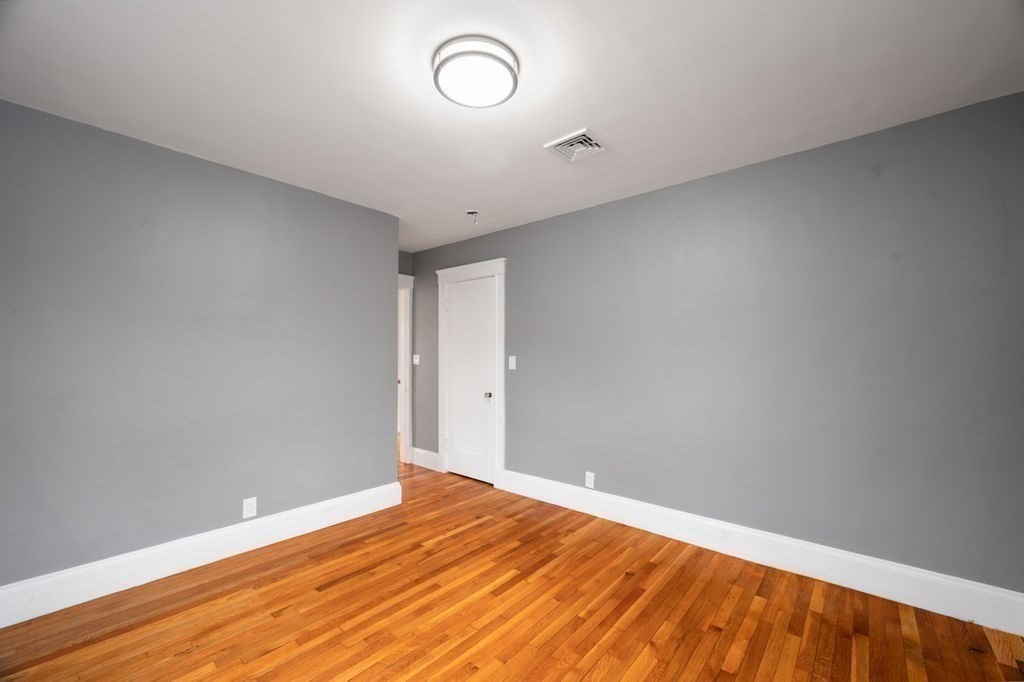 25 Tedesco Street Marblehead, MA 01945 - Photo 34 of 42 a view of empty room with wooden floor