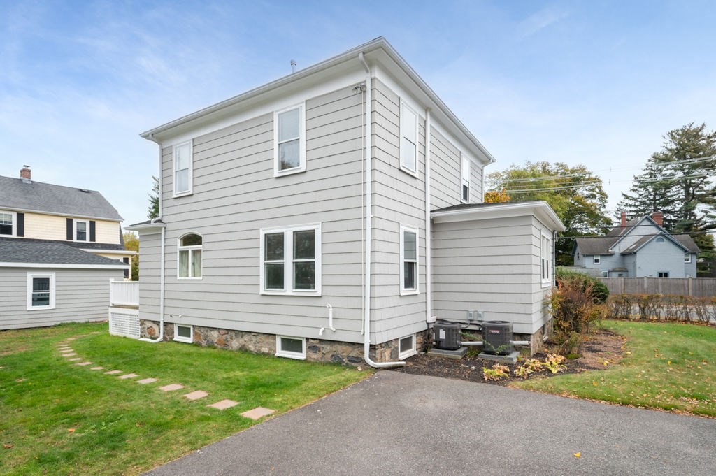 25 Tedesco Street Marblehead, MA 01945 - Photo 37 of 42 a front view of a house with a yard