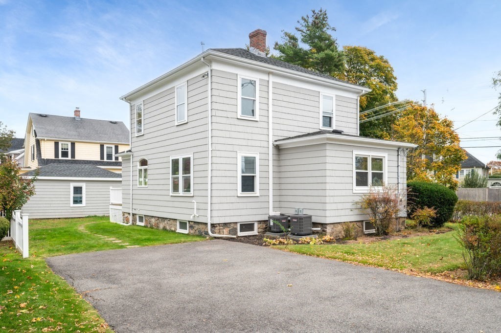 25 Tedesco Street Marblehead, MA 01945 - Photo 38 of 42 a front view of a house with a yard and garage