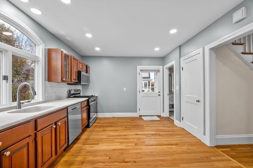 25 Tedesco Street Marblehead, MA 01945 - Photo 7 of 42 a large kitchen with stainless steel appliances granite countertop a refrigerator and a sink