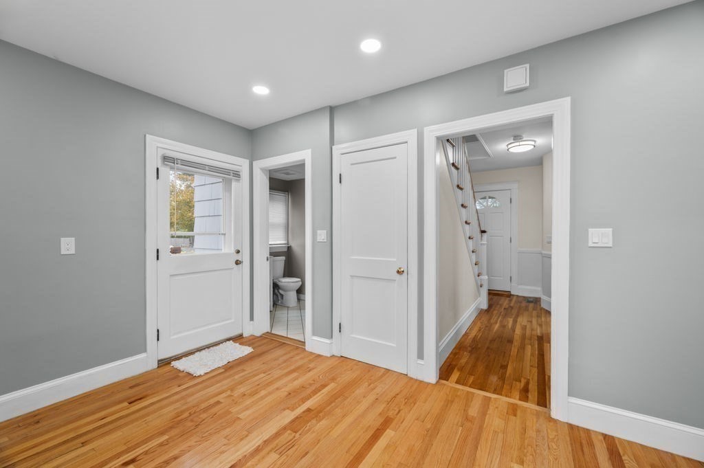 25 Tedesco Street Marblehead, MA 01945 - Photo 9 of 42 a bedroom with a bed and wooden floor
