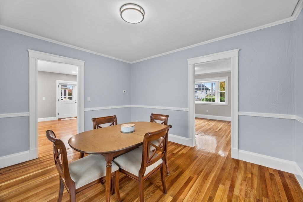 25 Tedesco Street Marblehead, MA 01945 - Photo 10 of 42 a view of a dining room with furniture and wooden floor