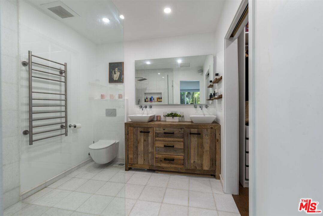 2429 Outpost Drive Los Angeles, CA 90068 - Photo 13 of 29 a bathroom with a granite countertop sink toilet and mirror