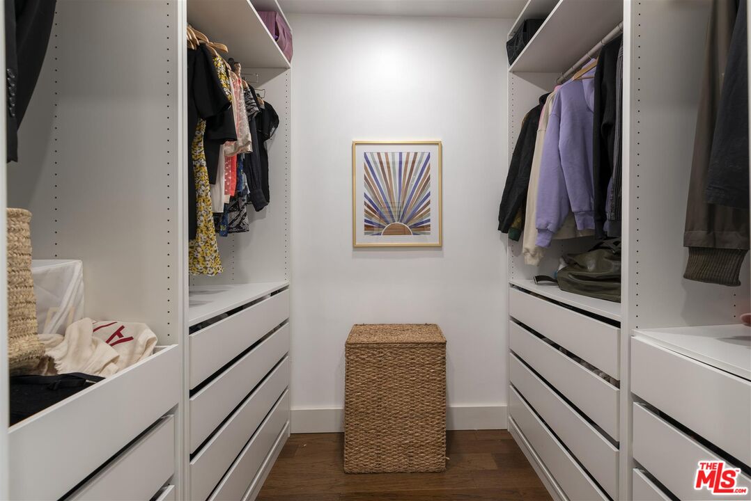 2429 Outpost Drive Los Angeles, CA 90068 - Photo 14 of 29 a view of walk in closet with clothes and shoes