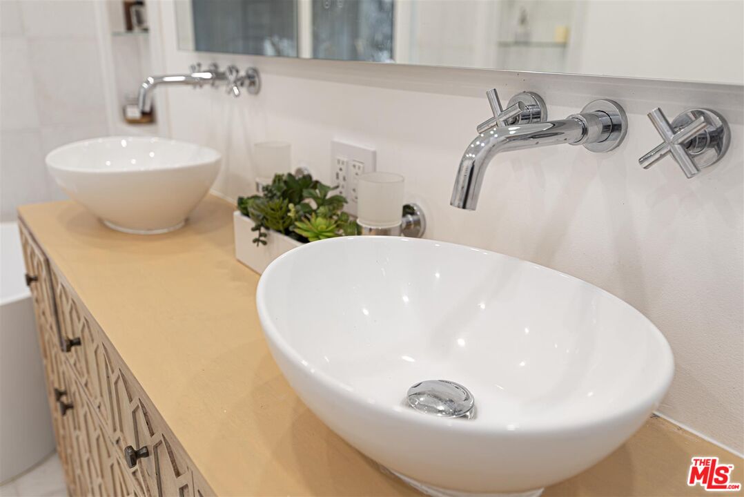 2429 Outpost Drive Los Angeles, CA 90068 - Photo 20 of 29 a bathroom with a sink and mirror