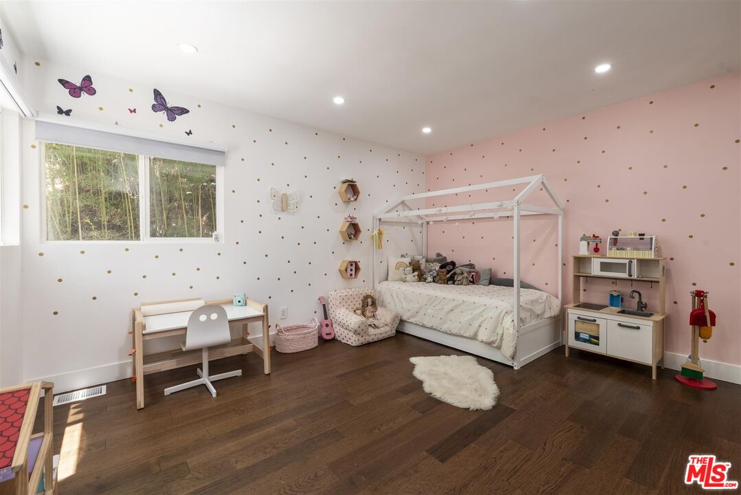 2429 Outpost Drive Los Angeles, CA 90068 - Photo 21 of 29 a bedroom with furniture and wooden floor