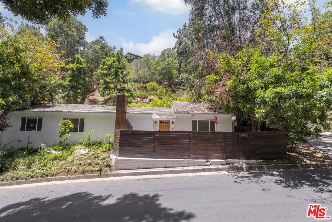 2429 Outpost Drive Los Angeles, CA 90068 - Photo 24 of 29 front view of a house with a yard