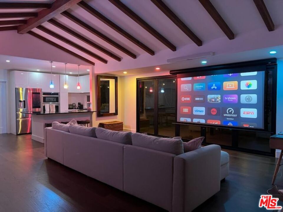 2429 Outpost Drive Los Angeles, CA 90068 - Photo 29 of 29 a living room with furniture and a flat screen tv