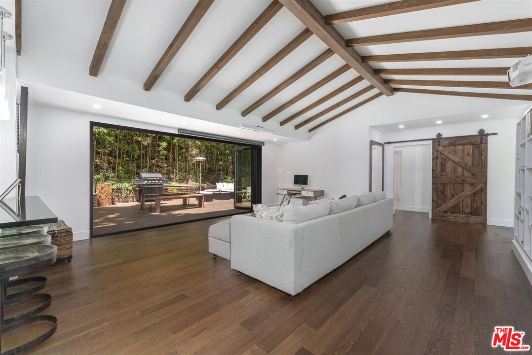 2429 Outpost Drive Los Angeles, CA 90068 - Photo 7 of 29 a living room with furniture and a floor to ceiling window