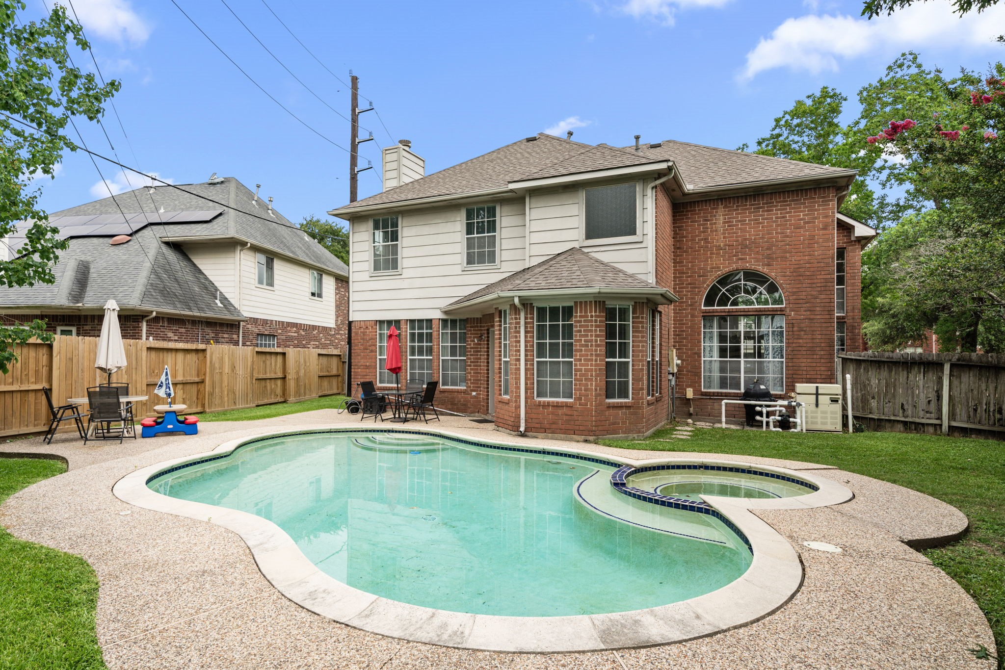 9715 Therrell Drive Houston, TX 77064 - Photo 29 of 33 a view of a house with swimming pool and porch